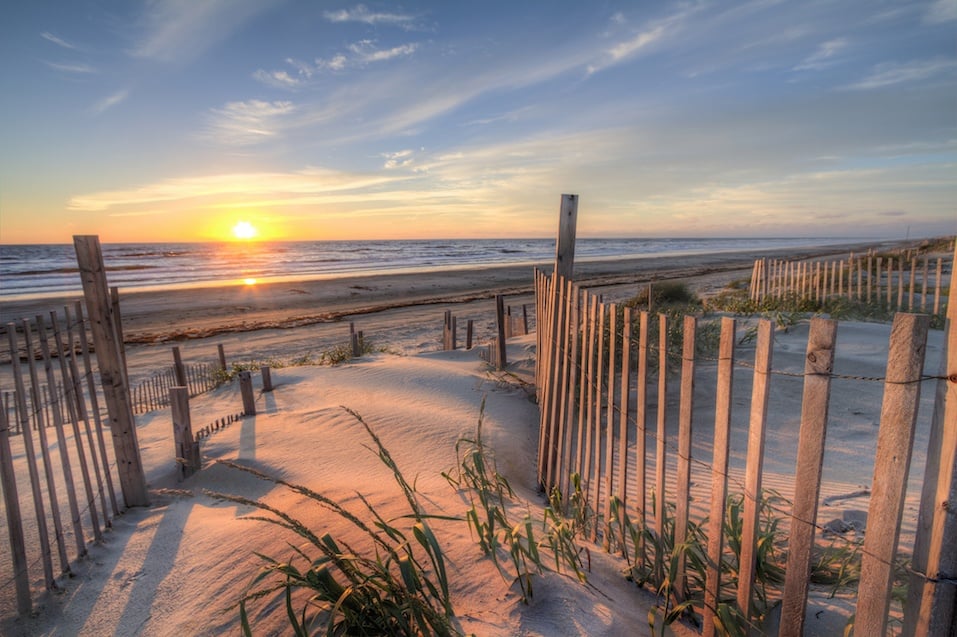 Sunrise as seen from the sand dunes at the Outer Banks, NC around Corolla Beach in September, 2014.