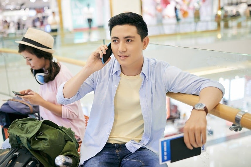 Vietnamese man sitting at airport