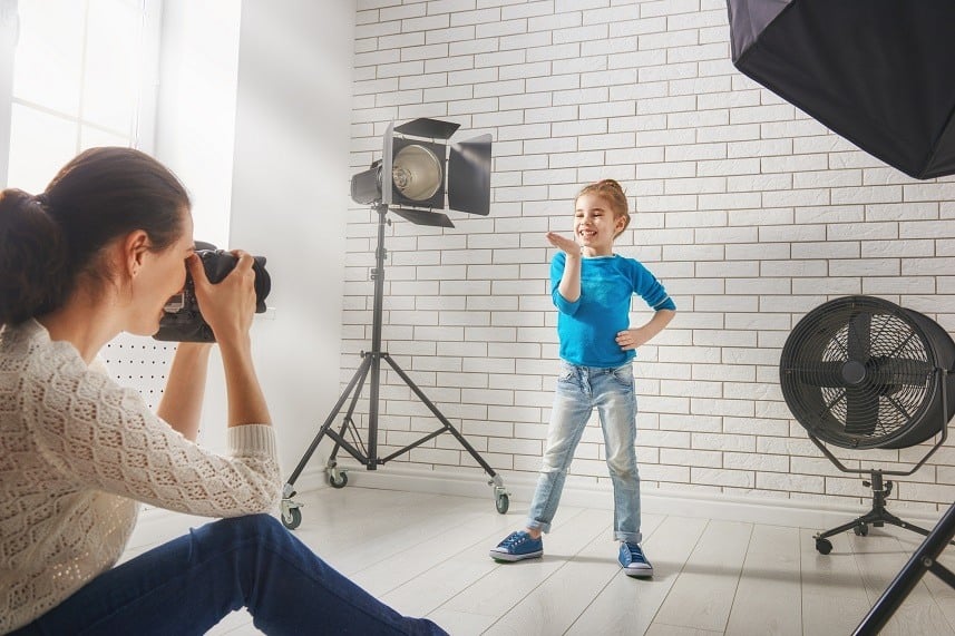 woman photographs a child
