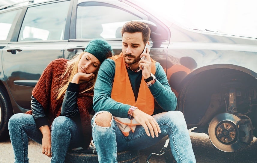 Couple on the road having problem with a car