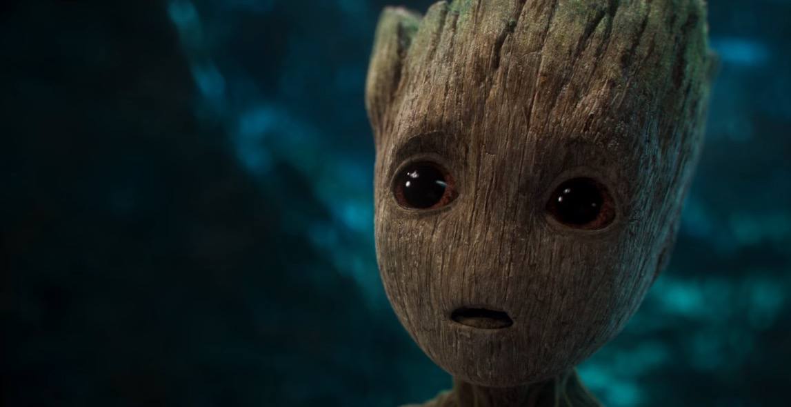 A close-up on Baby Groot, looking up bemusedly