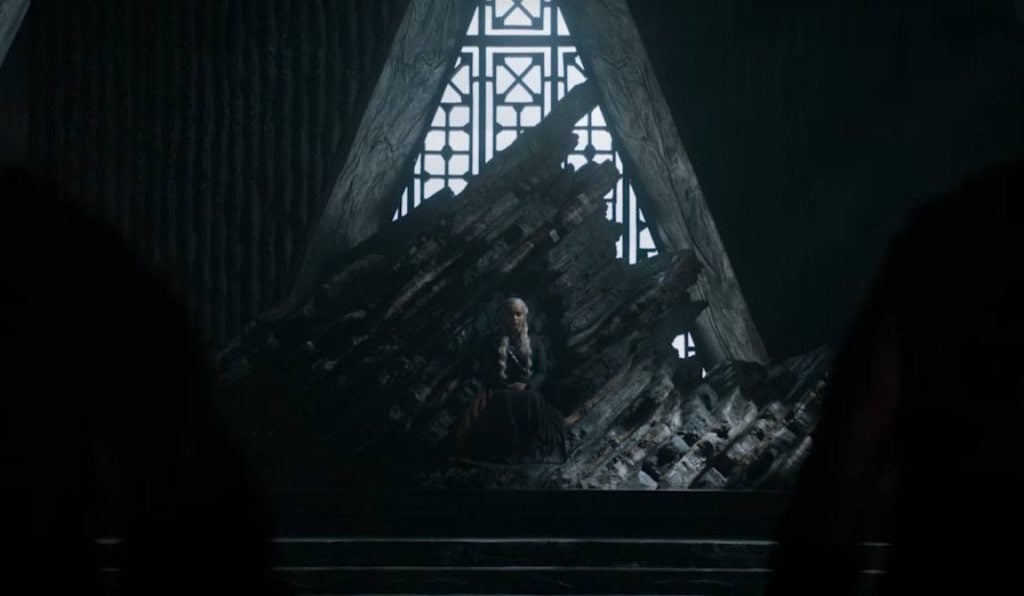 Daenerys sits on the windswept throne of Dragonstone in a darkened room