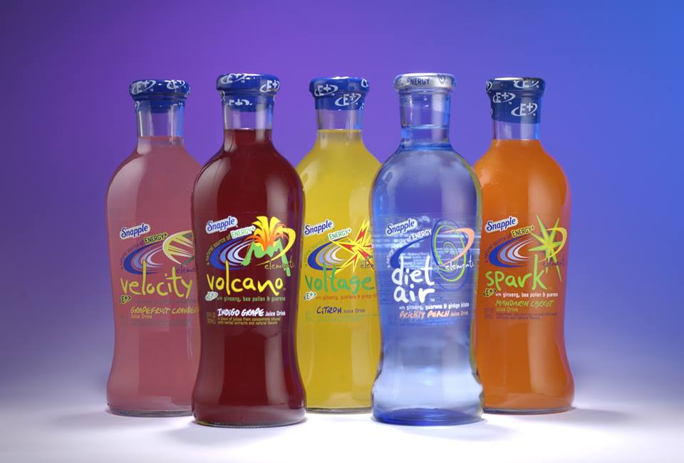Different colored bottle of Snapple drinks against a blue backdrop Snapple Elements