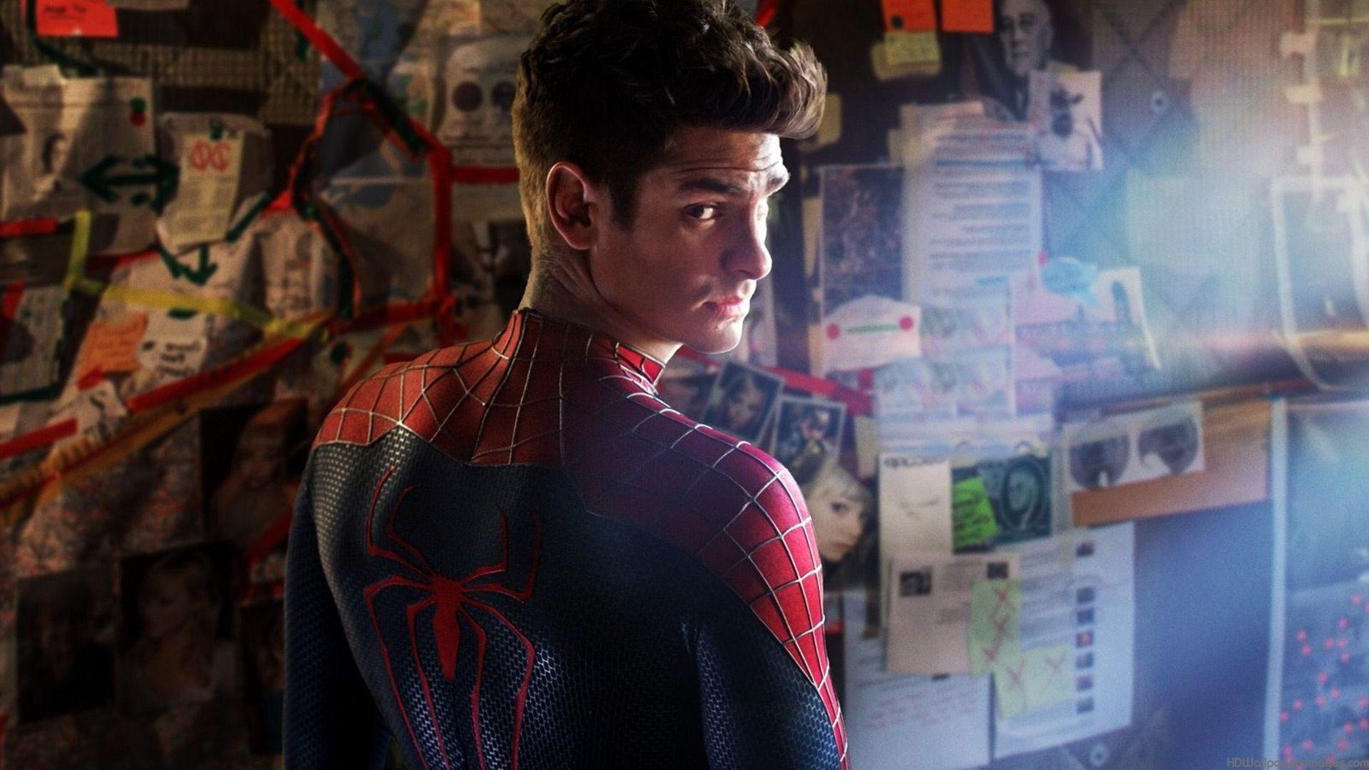 Andrew Garfield as Spider-Man, with his back to the camera and his mask off