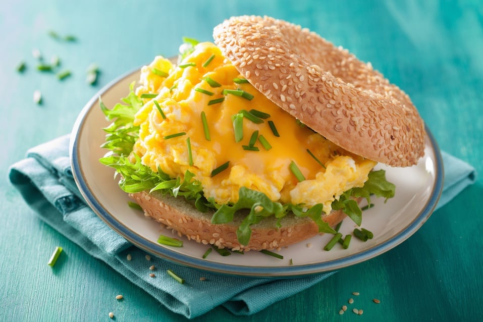 breakfast sandwich on bagel with egg cheese lettuce
