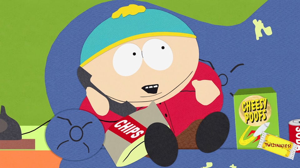 Eric Cartman, sitting on a couch on the phone, next to a back of chips on his lap