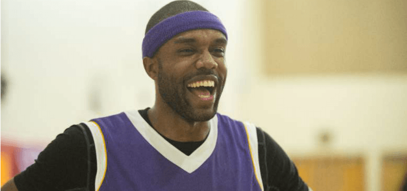 DeMario Jackson is in a purple jersey and has a purple headband on.