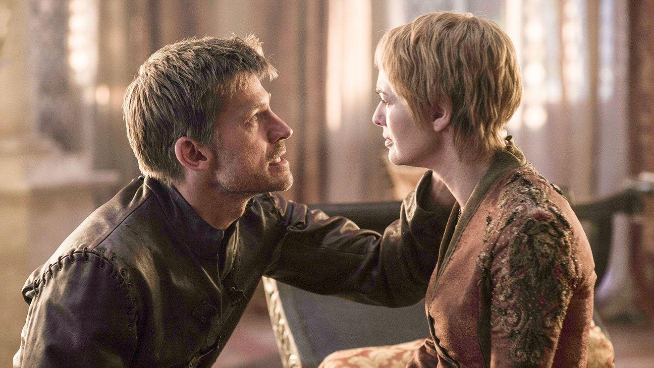 Jaime holding Cersei's head in his hand, kneeling in front of her as they look into each other's eyes