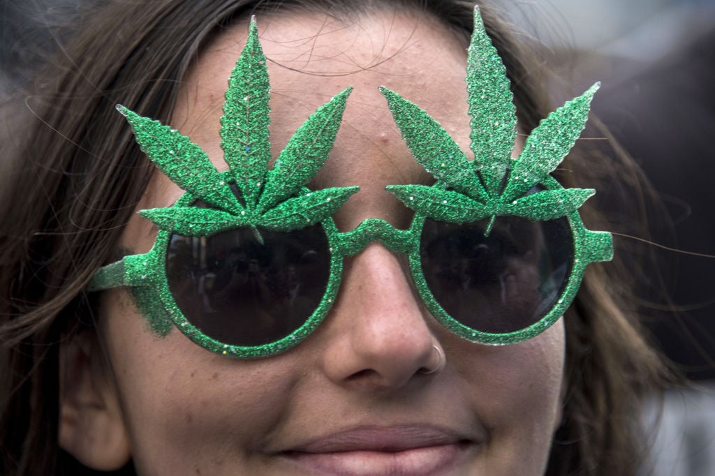 person with marijuana-shaped sunglasses