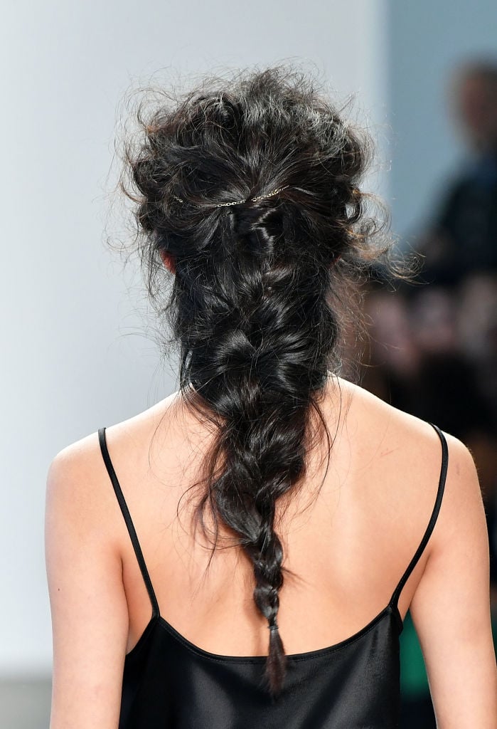 A model, hair detail, walks the runway at Ane Amour fashion show