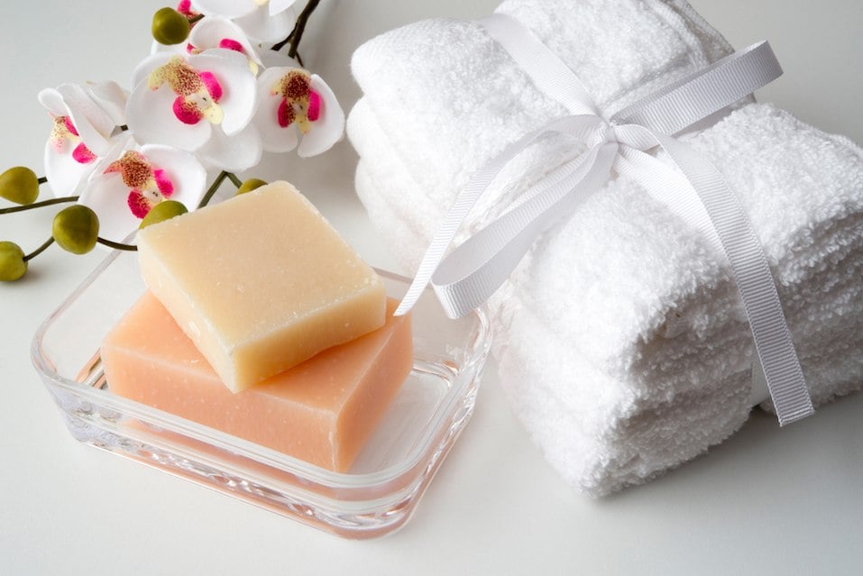 orchid, white towels and soaps