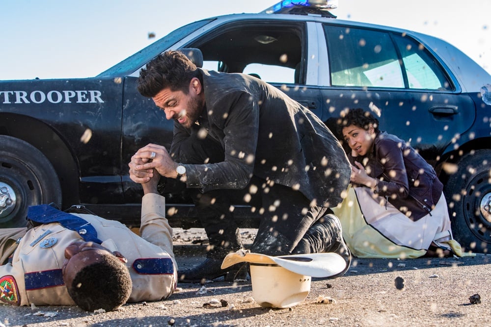 Dominic Cooper fights a sheriff outside of a police car in Preacher