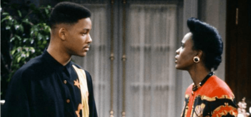 Will Smith and Janet Hubert are looking at each other angrily in The Fresh Prince of Bel-Air.