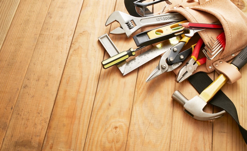 tool belt with tools on wood planks with copy space