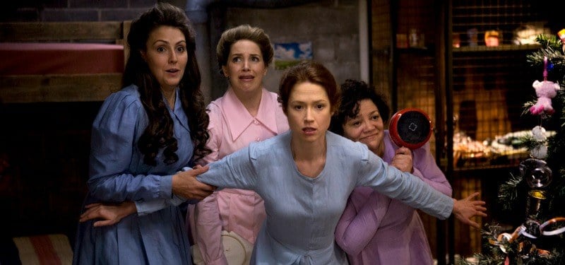 All of the other bunk women hide behind Kimmy in the bunker.