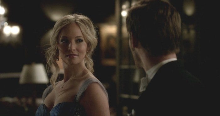 Claire Holt looks at a man in a scene from The Originals