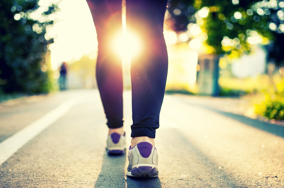 Fitness concept and welfare with female athlete joggin in city park