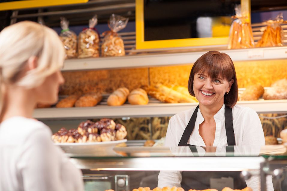 woman is buying baked products