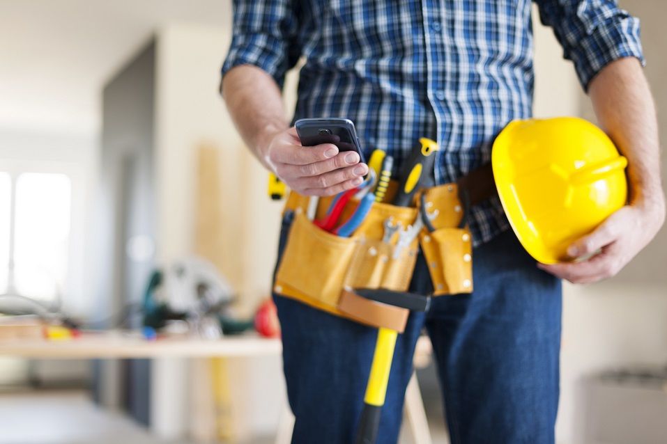 construction worker with mobile phone