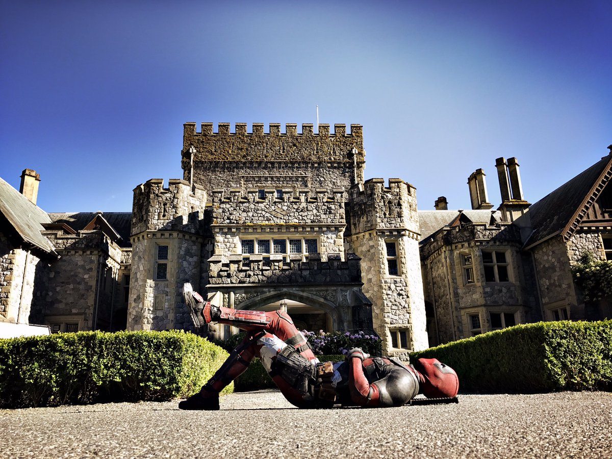 Deadpool lies in front of the X-Mansion