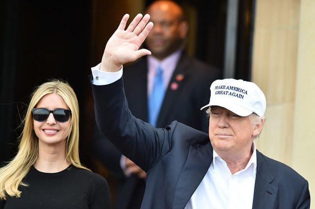 Donald Trump waves while standing next to Ivanka Trump. Donald Trump waves while standing next to Ivanka Trump.