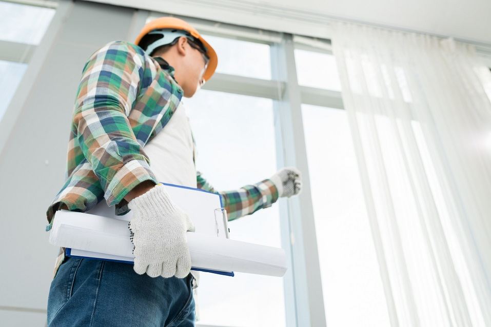 Foreman examining house