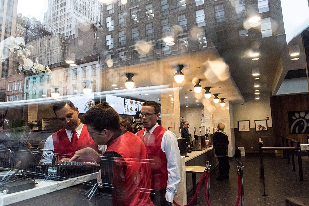 Employees work inside of Chick-Fil-A, a day before its opening