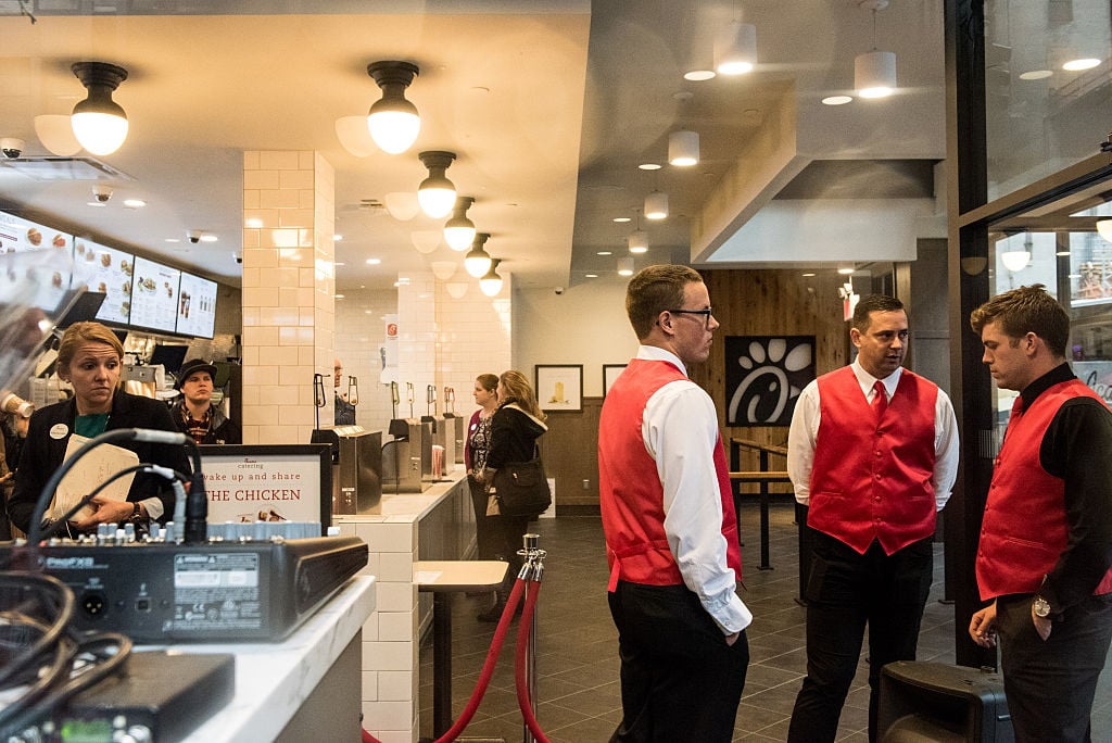 Employees work inside of Chick-Fil-A, a day