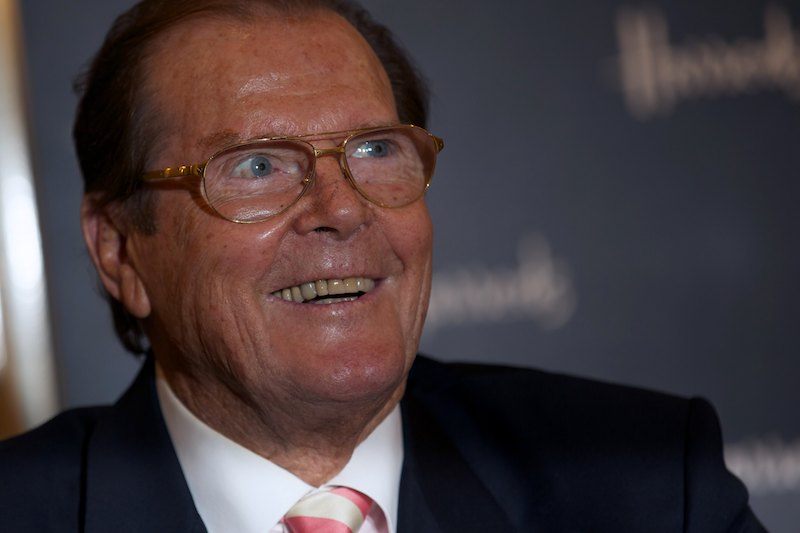 British Actor Roger Moore poses for photographs at the launch of his book Bond on Bond