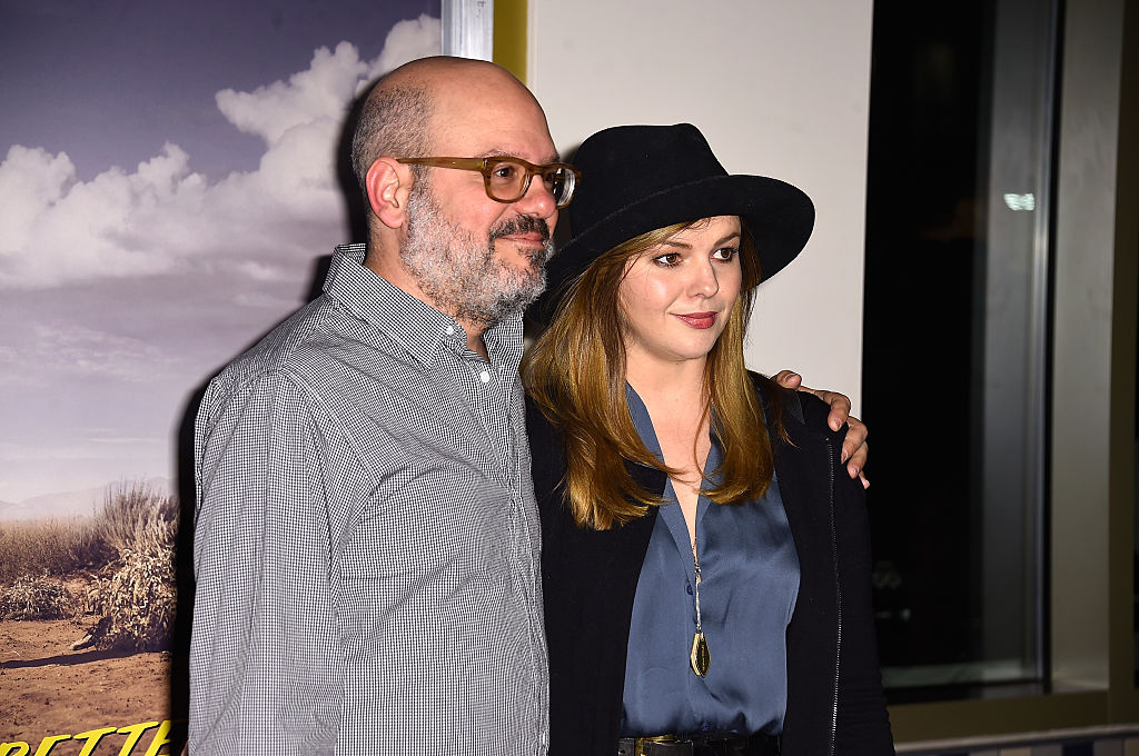 David Cross smiling, with his arm around Amber Tamblyn