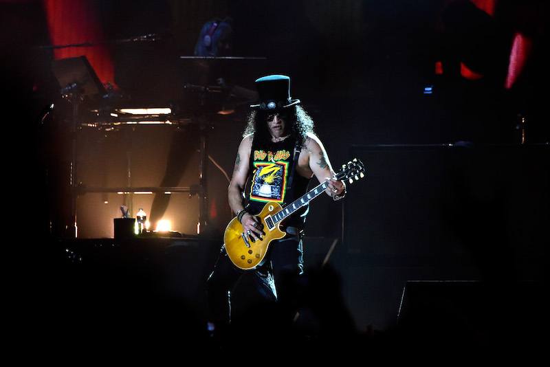 Musical group Guns N' Roses performs onstage