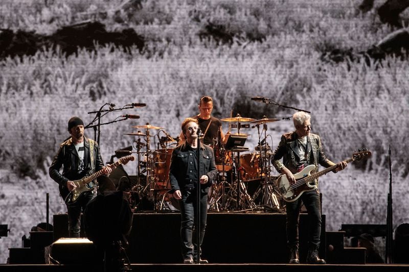 The Edge, Larry Mullen Jr., Bono, and Adam Clayton of U2 perform on The Joshua Tree Tour