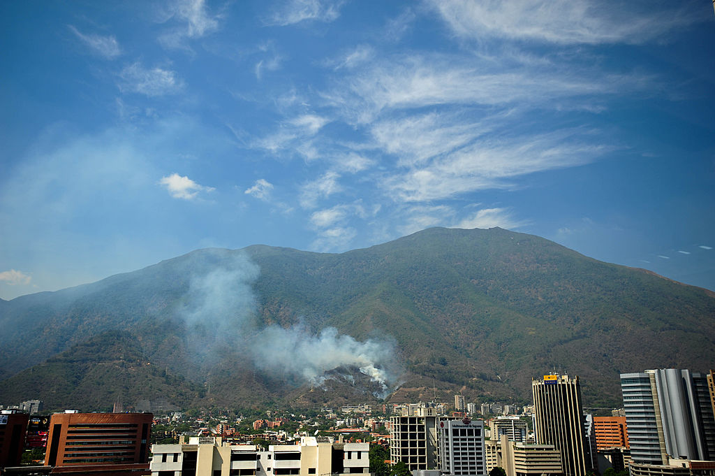 Smoke billows from El Avila National Park, as fires caused by the intense heat