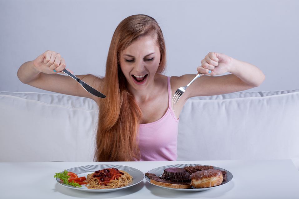 Young girl eating a lot of food Young girl eating a lot of food