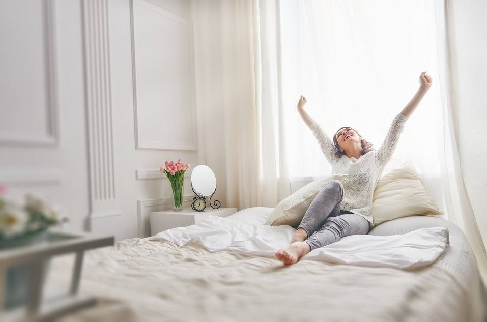 young woman enjoying sunny morning