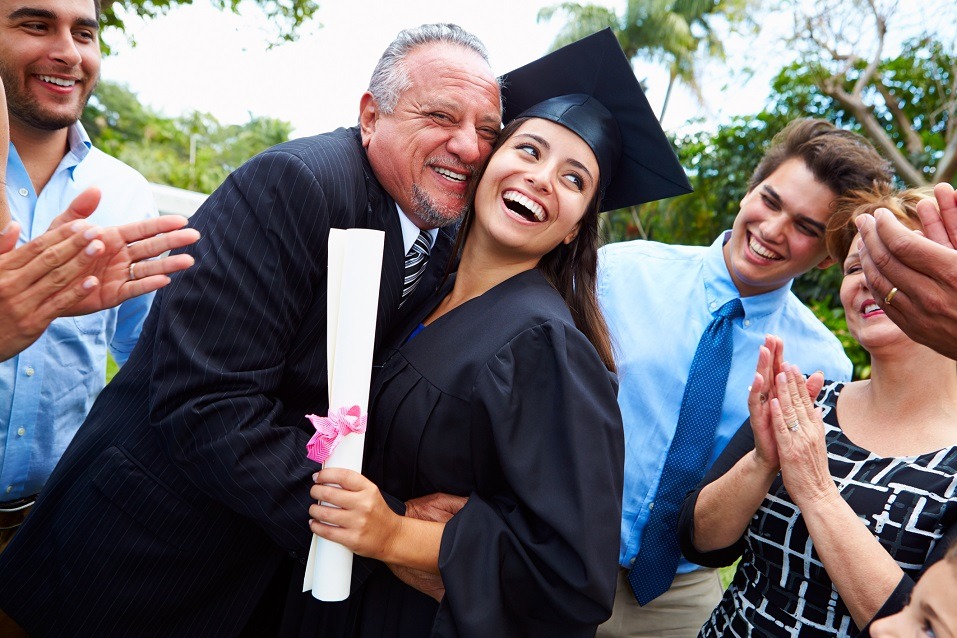 Hispanic Student And Family Celebrating