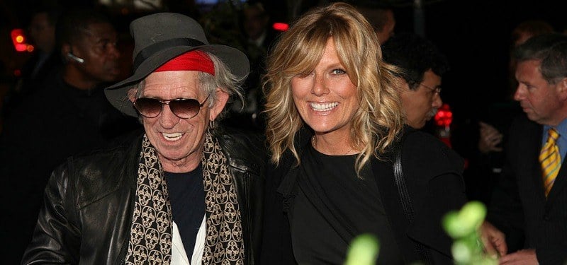 Keith Richards and Patty Hansen are smiling together.