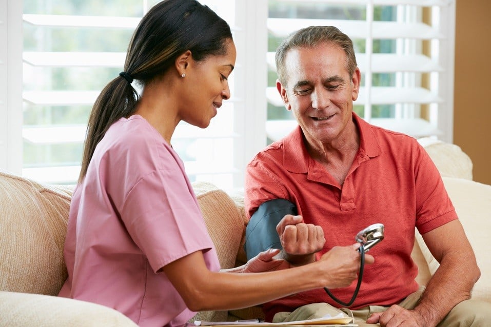 Nurse Visiting Senior Male Patient