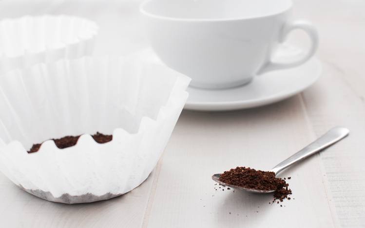 Paper filter and ground coffee