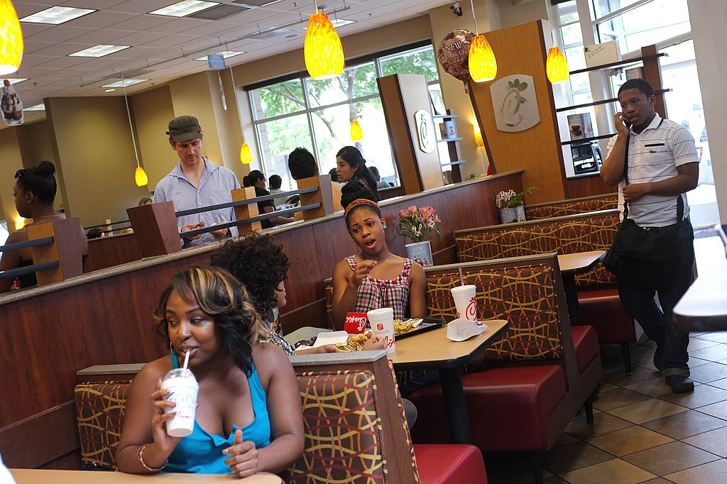 Patrons are seen inside a Chick-fil-A restaurant