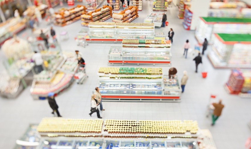 People shopping in a large supermarket