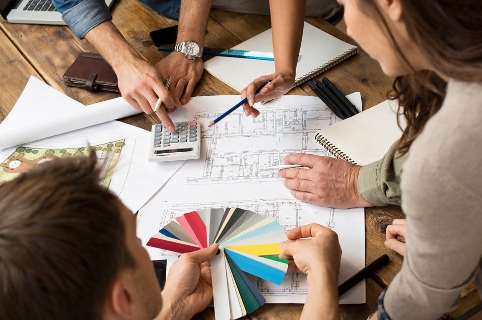Architects team discussion on blueprints