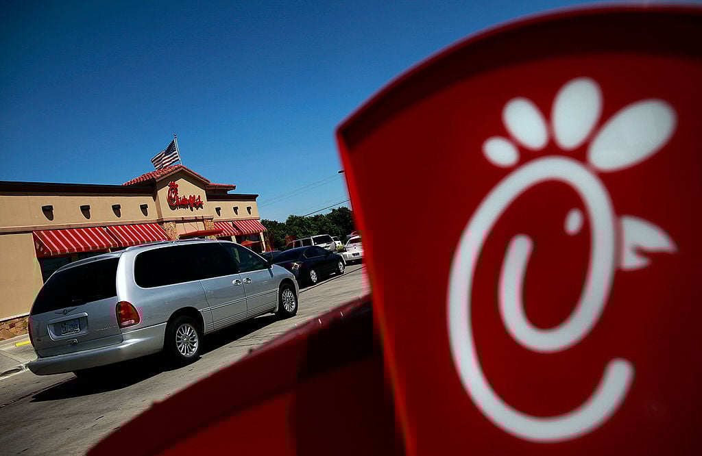 Drive through customers wait in line at a Chick-fil-A restaurant