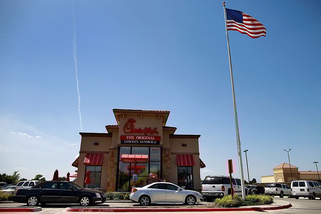 Drive through customers wait in line at a Chick-fil-A restaurant