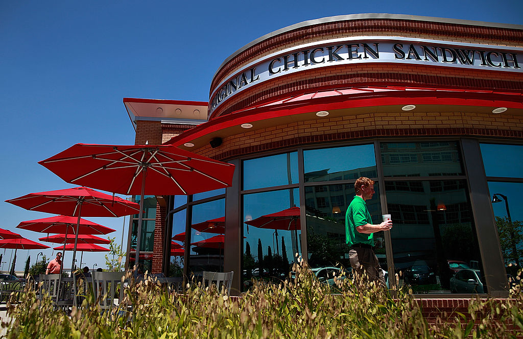 A Chick-fil-A customer walks past the resturant