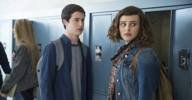 Hannah and Clay talk to each other in front of school lockers in '13 Reasons Why'. Hannah and Clay talk to each other in front of school lockers in '13 Reasons Why'.
