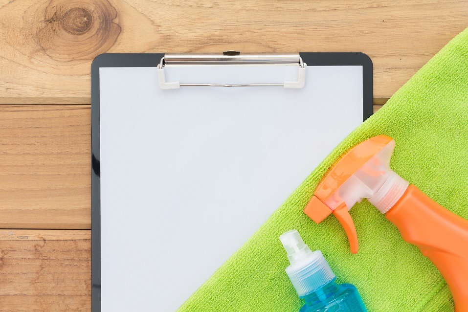 cleaning products, cloth, and clipboard