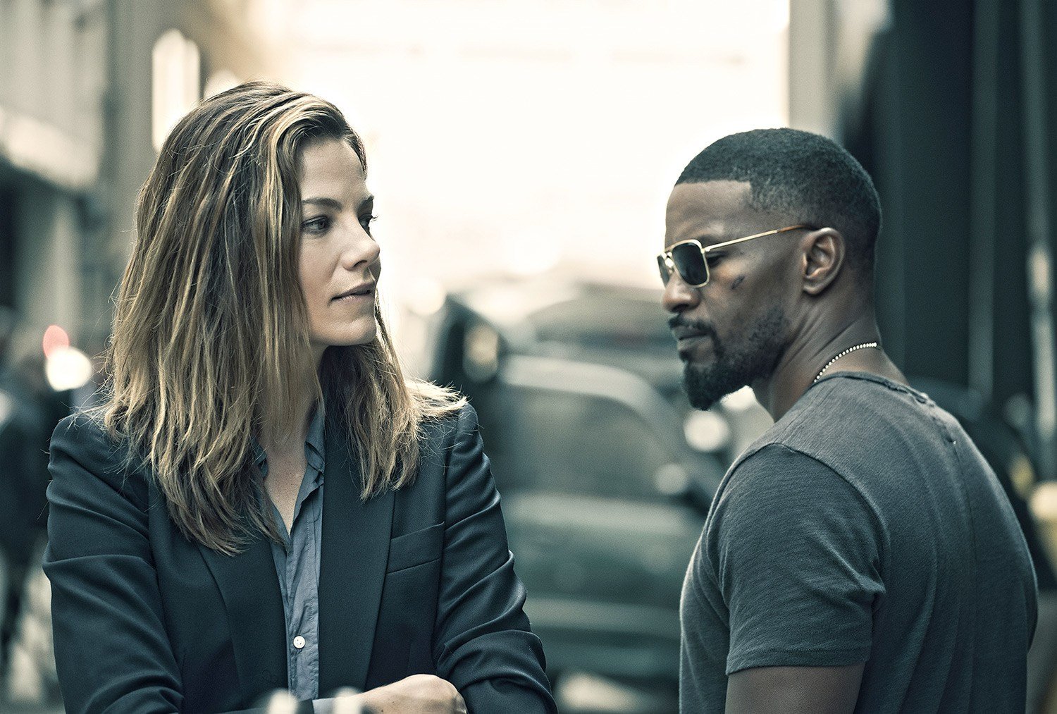 Michelle Monaghan and Jamie Fox stand next to each other in a street