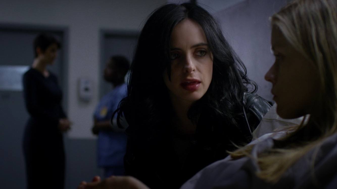 Jessica talks to Hope who is lying in a hospital bed