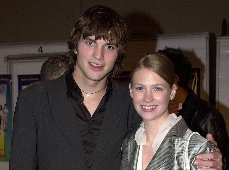Ashton Kutcher puts his arm around January Jones